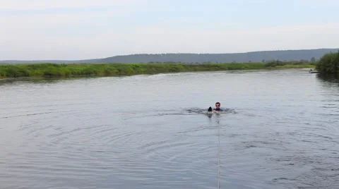 Man waterskiing on river Stock Footage 66185783