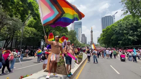 Man wave a rainbow flag during the Gay Pride Parade, Mexico City 4K Stock-Footage 312122643