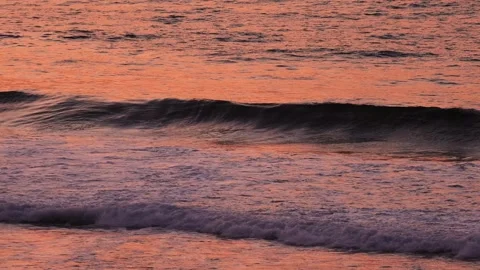 Man on the waves against sunset Stock Footage 275570373