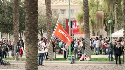 Man Waves Jesus is King Flag at Pro-Life Protest Slow Motion 4K Stock-Footage 164504994