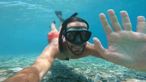Man Waves Underwater In The Sea Stock Footage 246525617