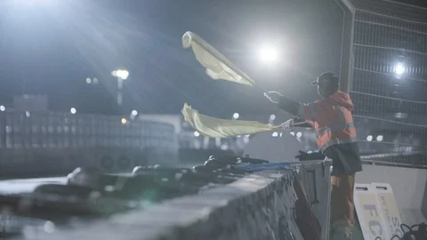 Man Waving Checkered Race flag Stock Footage 114459208