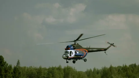 Man waving his hand from the window of the helicopter Video stock 93170102