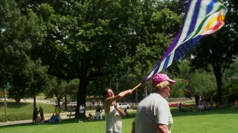 Man Waving Large Rainbow Flag Stock Footage 195710223
