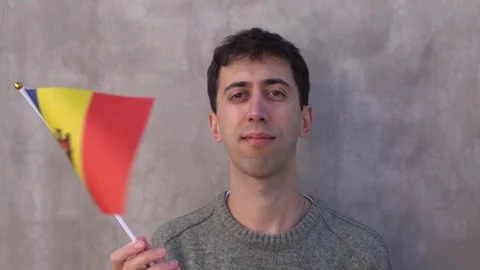 Man waving Moldovan flag. Concept of patriotism. Slow motion. Stock Footage 336414165