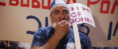 A man waving poster during the protest Stock Footage 152848877