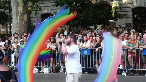 Man Waving Rainbow Flag During Madrid Pride Parade (MADO) 2026 Stock Footage 339198499