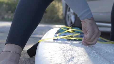 Man waxing surfboard Stock Footage 100470616