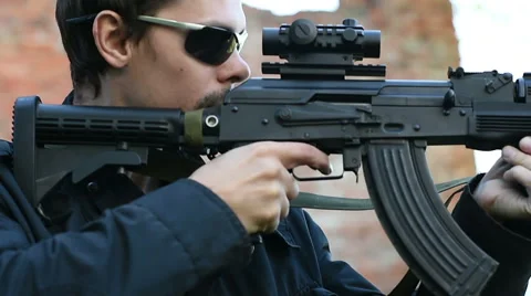 Man with weapon a side view 動画素材 60389270