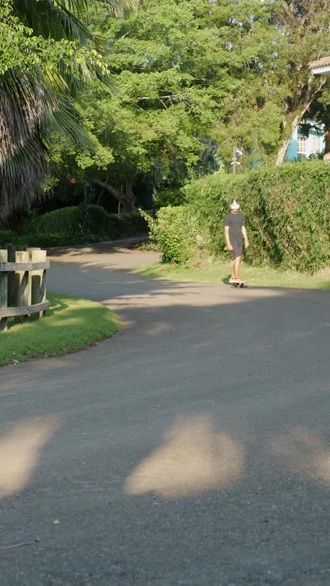 Man wearing augmented virtual reality goggles riding skateboard. Stock Footage 269742526