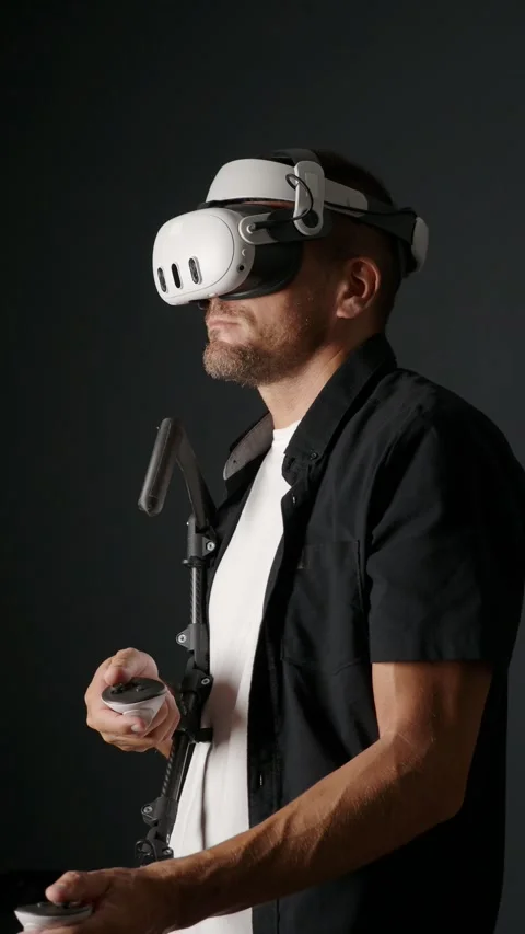 Man wearing augmented VR Headset and playing virtual reality games at home. Stock Footage 282322192