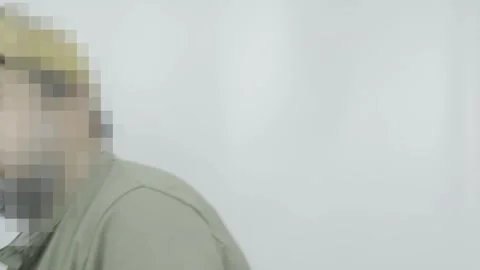 Man wearing baseball hat posing in front of camera, turning from front Stock Footage 311314637