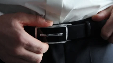 A man wearing a belt strap Stock Footage 87321865