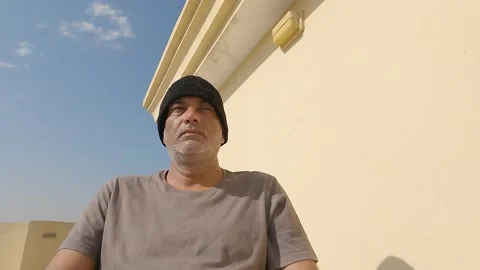 Man wearing black cap shaking his head left to right and is in the deep think Stock Footage 300009668