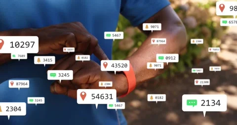 Man wearing blue shirt tapping smartwatch on path, checking alerts as pins chats Stock Footage 331269647