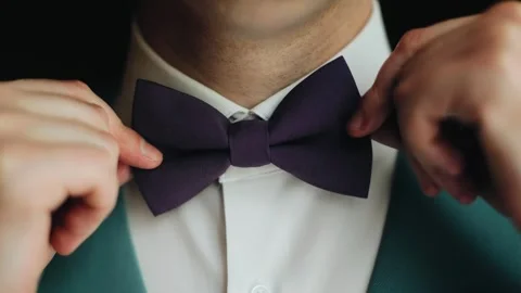 The man is wearing a bow tie. Close-up shooting of men's accessories Stock Footage 303486647