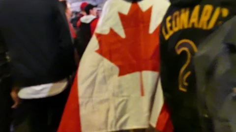 Man wearing Canada flag has cape 動画素材 114813270