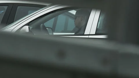 Man Wearing Dark Glasses Sitting in the White Car Stock Footage 87863126