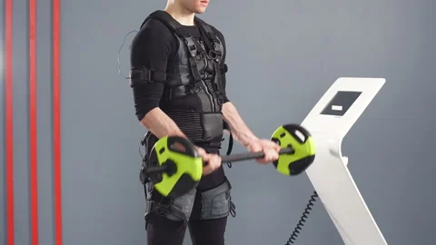 Man wearing electrostimulation suit working out EMS training with barbell. Stock Footage 87361368