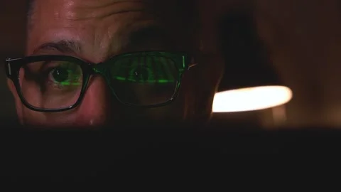 Man wearing eyeglasses looking at screen with reflections Stock Footage 322810291