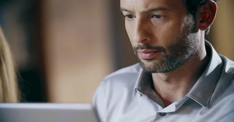 Man wearing eyeglasses using tablet.Corporate business team work office meeting 스톡 동영상 80136729