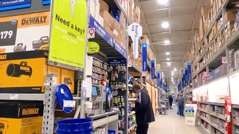 Man wearing a face mask at the key machine Lowes Stock Footage 144007015
