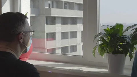 Man wearing a face mask taking his temperature Stock Footage 126709526