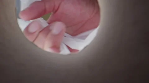 Man wearing a face mask taking face masks and sanitizers out of bag Stock Footage 131691209