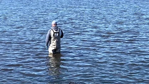 https://images.pond5.com/man-wearing-fishing-waders-standing-footage-139932708_iconl.jpeg