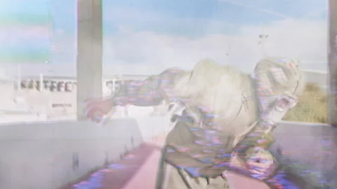Man wearing gasmask and suit outdoors Stock Footage 221025252