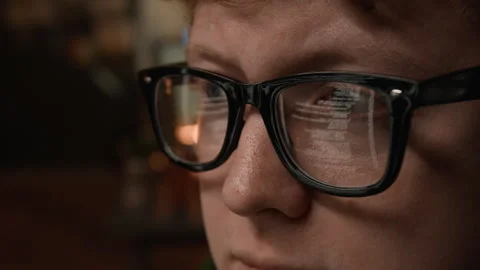 Man Wearing Glasses with Computer Code Reflection Programming on Screen 動画素材 336717886