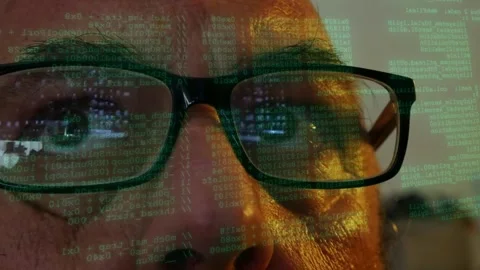 Man wearing glasses watching lines of code algorithm scanning displayed on Stockbeeldmateriaal 342076171