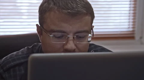 Man Wearing Glasses Working With Computer Slow-Motion 50Fps Stock Footage 69067460