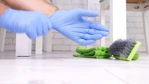 Man Wearing Gloves Use Wipe and Plastic Brush to Clean the Floor Stock Footage 81947083