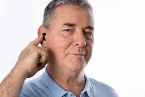 MAN WEARING HEADSET WHITE BACKGROUND Stock Photos