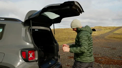 Man Wearing His Backpack From The Car Stock Footage 234136456