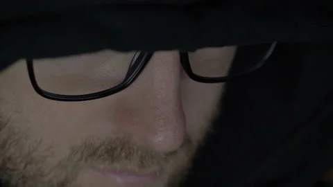 Man Wearing a Hood and Coding Stock Footage 208746161