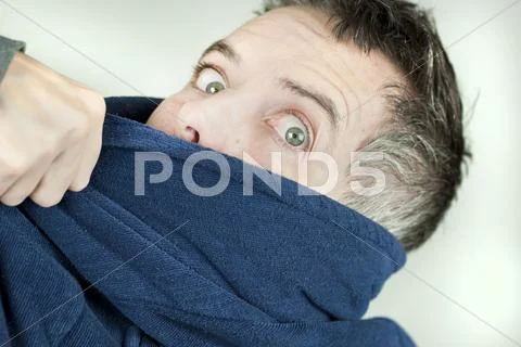 Man wearing housecoat being yanked off camera Stock Photos