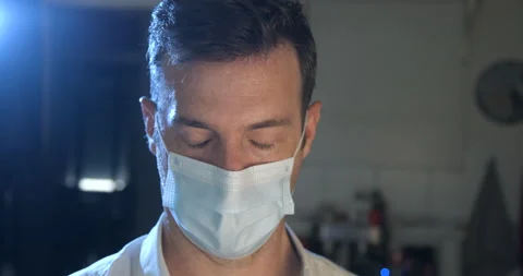 Man wearing mask with sad expression in slowmotion Stock Footage 137924508