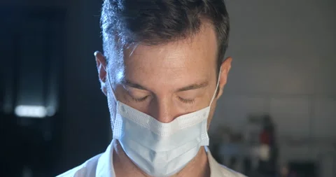 Man wearing mask with sad expression in slowmotion Stock Footage 137924510