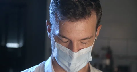 Man wearing mask with sad expression in slowmotion Видео 137924516