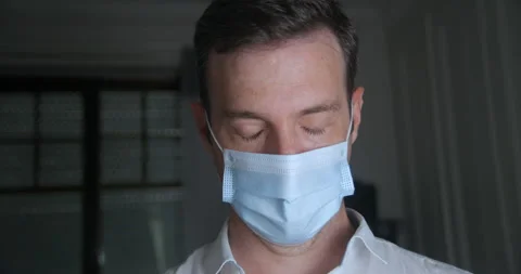 Man wearing mask with sad expression in slowmotion Stock-Footage 137924803