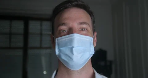 Man wearing mask smiling and showing it's ok in slowmotion Видео 137924722
