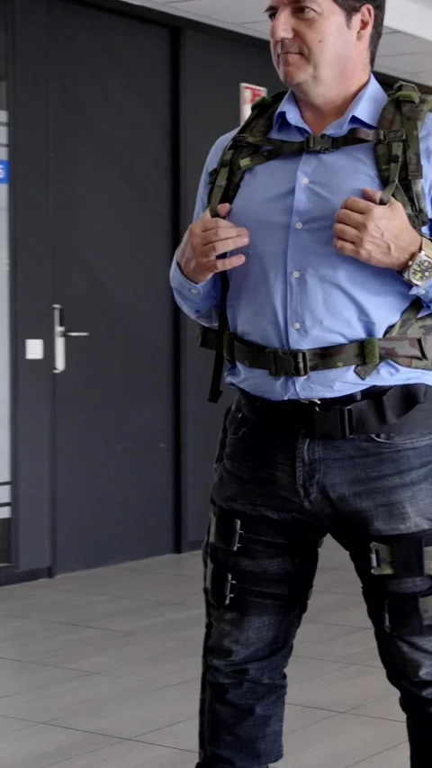 Man wearing military exoskeleton prototype Stock Footage 257973219