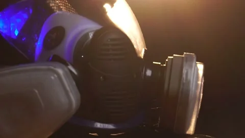 Man wearing protective suit and gas mask standing in fog Stock-Footage 221083265