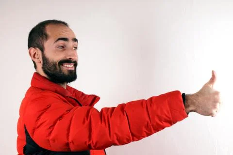 Man wearing red jacket thumbs up Stock Photos