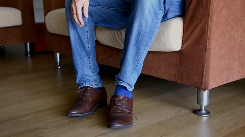 Man wearing shoe and preparing to go out Stock Footage 129175243