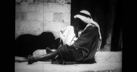 Man wearing shoes at Moslem shrine Stock Footage