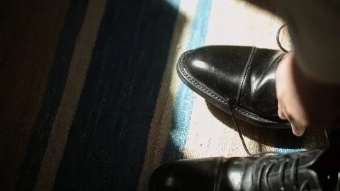 Man wearing shoes, tie the laces Stock Footage