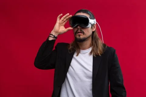 Man wearing spatial computing AR headset, interacts with virtual environment Fotos Stock
